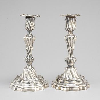A pair of Louis XV mid 18th century candlesticks.