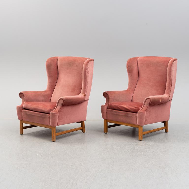 A pair of model 3543 'Oxford' easy chairs by Ragnar Helsén, Svenskt Tenn.