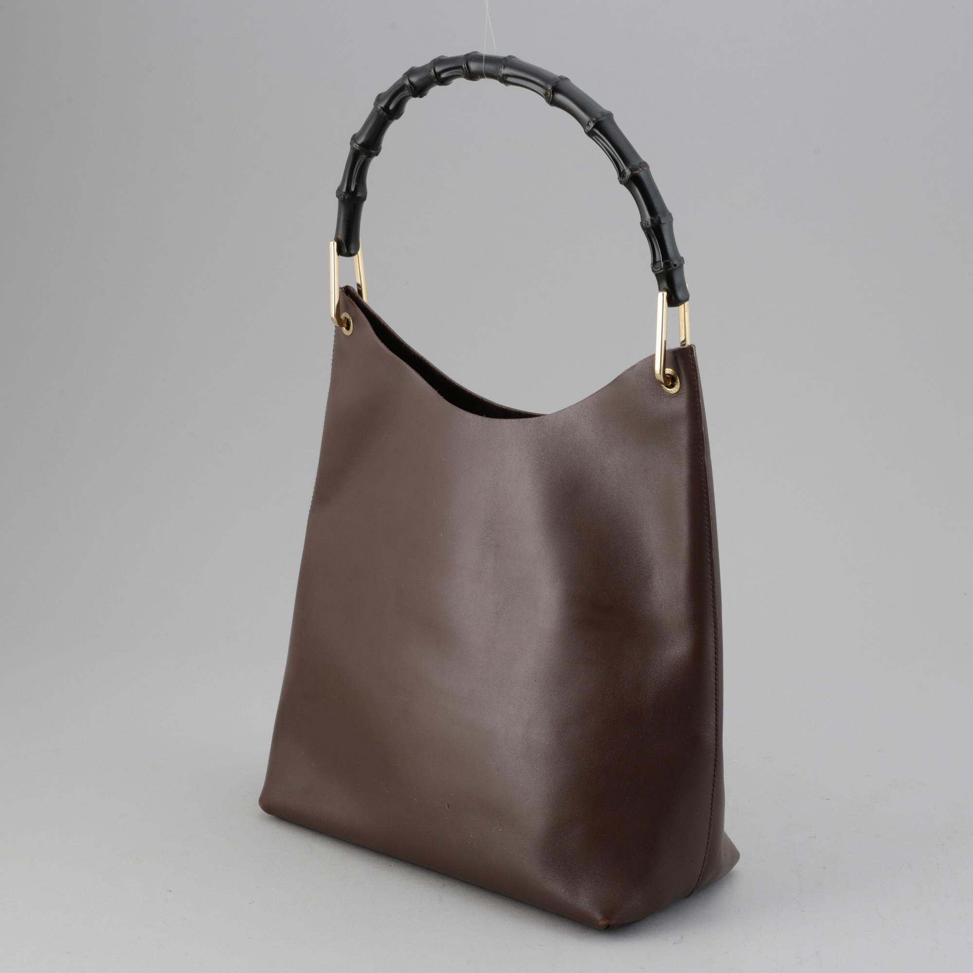 Gucci, a leather bag.