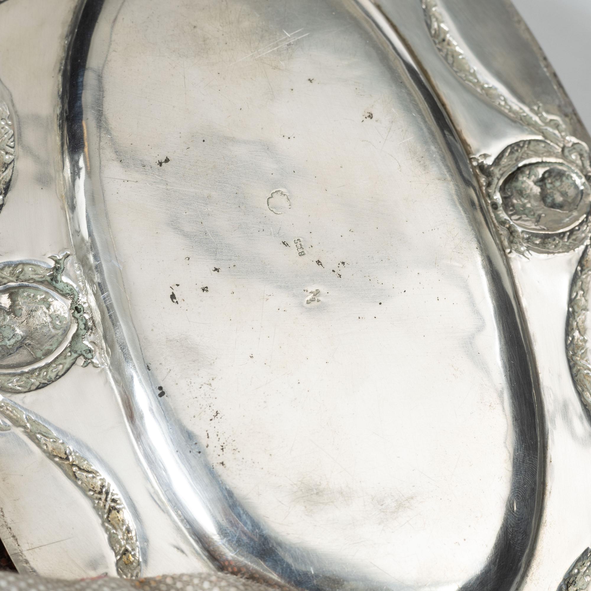A Rococo style silver sauce boat with dish, 20th Century.