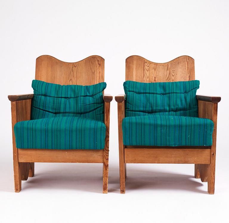 Axel Einar Hjorth, a pair of "Utö" stained pine armchairs, Nordiska Kompaniet 1930s.