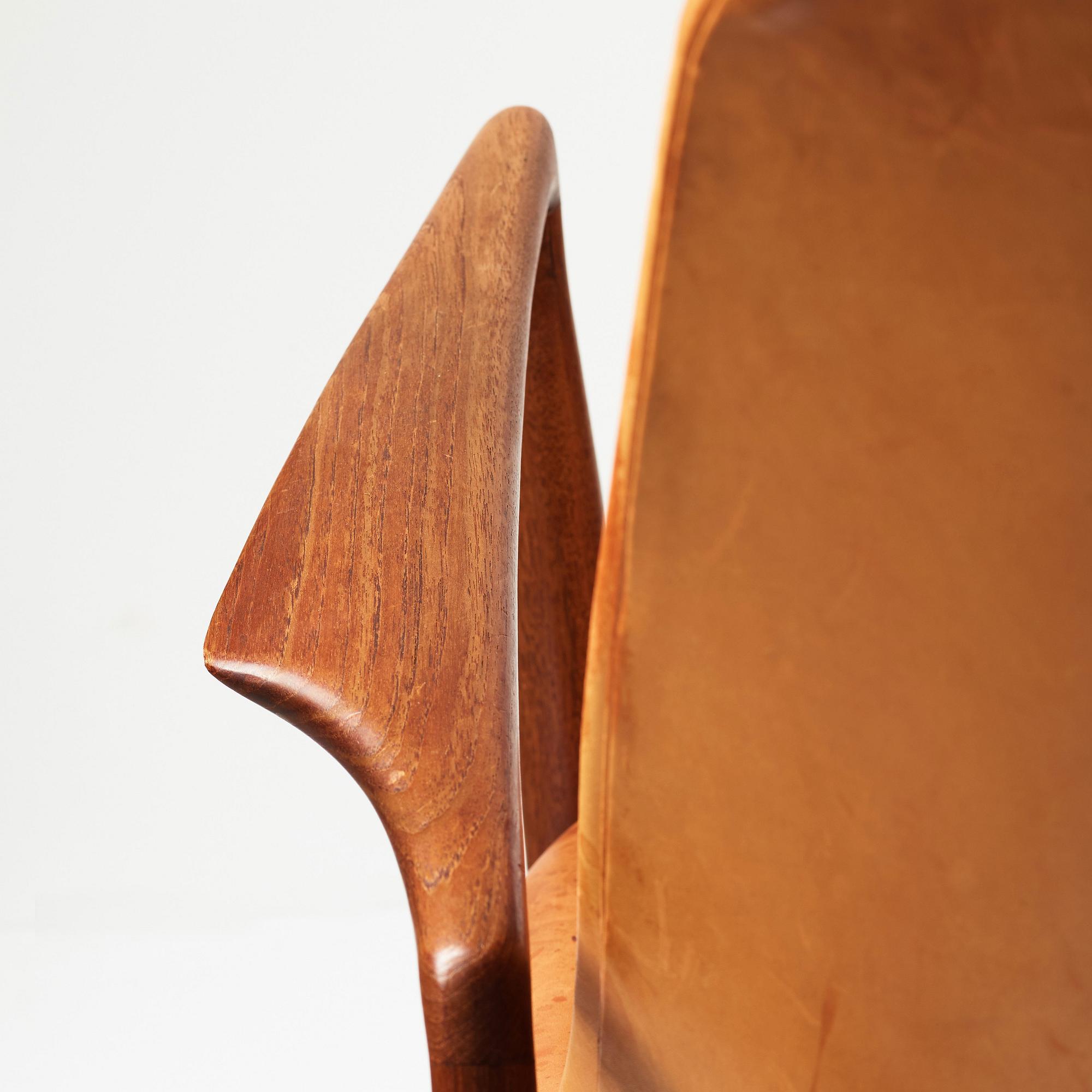 Ib Kofod-Larsen, a "Seal" teak and brown leather armchair, Olof Persson Möbler, Jönköping, Sweden 1950-60's.