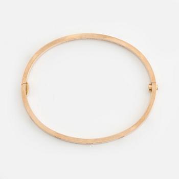 A Cartier "Love" bracelet small model in 18K rose gold with ten round brilliant-cut diamonds.