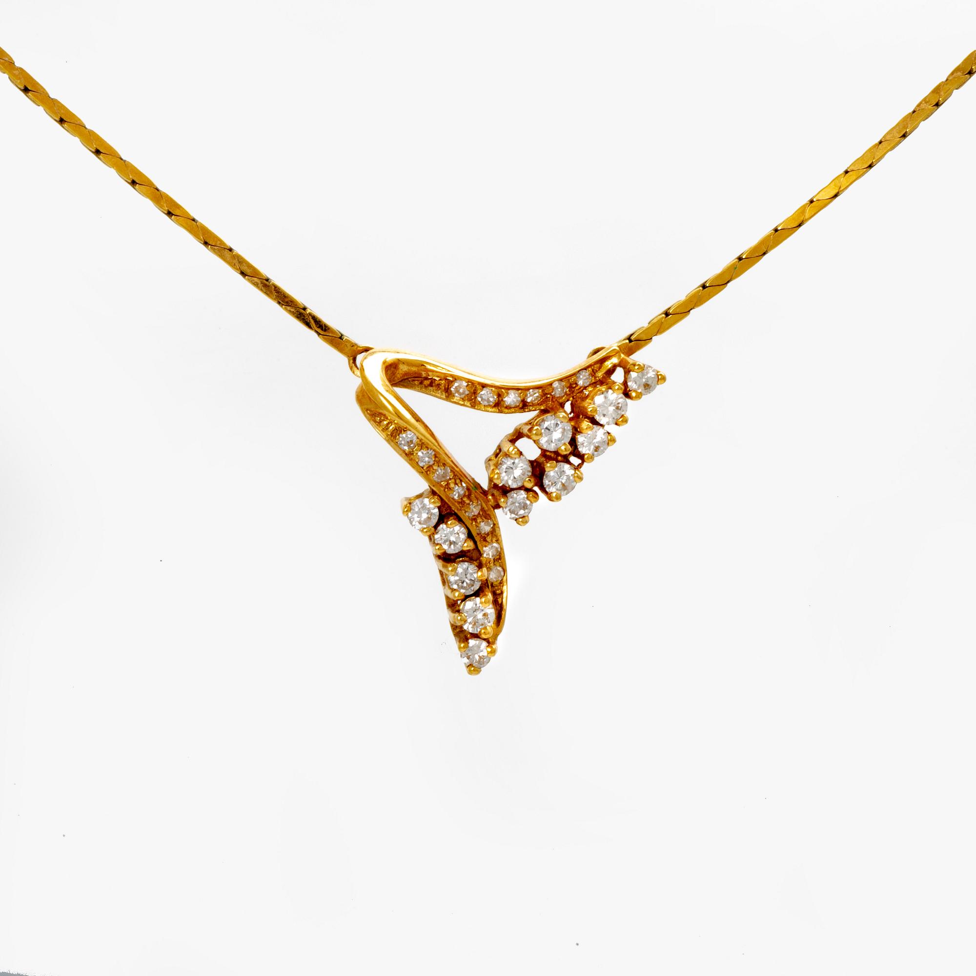 An 18K gold necklace with round brilliant cut diamonds.