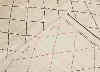 A Moroccan rug, c. 290 x 197 cm.