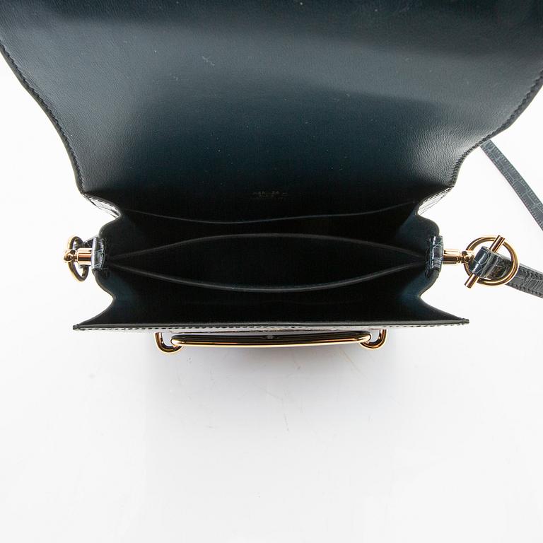 Hermès, bag "Green Shiny Alligator Mini Roulis 18 Permabrass Hardware" 2021.