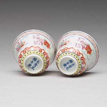 A pair of Chinese famille rose ba jixiang wine cups, Republic, with Guangxu six character mark.