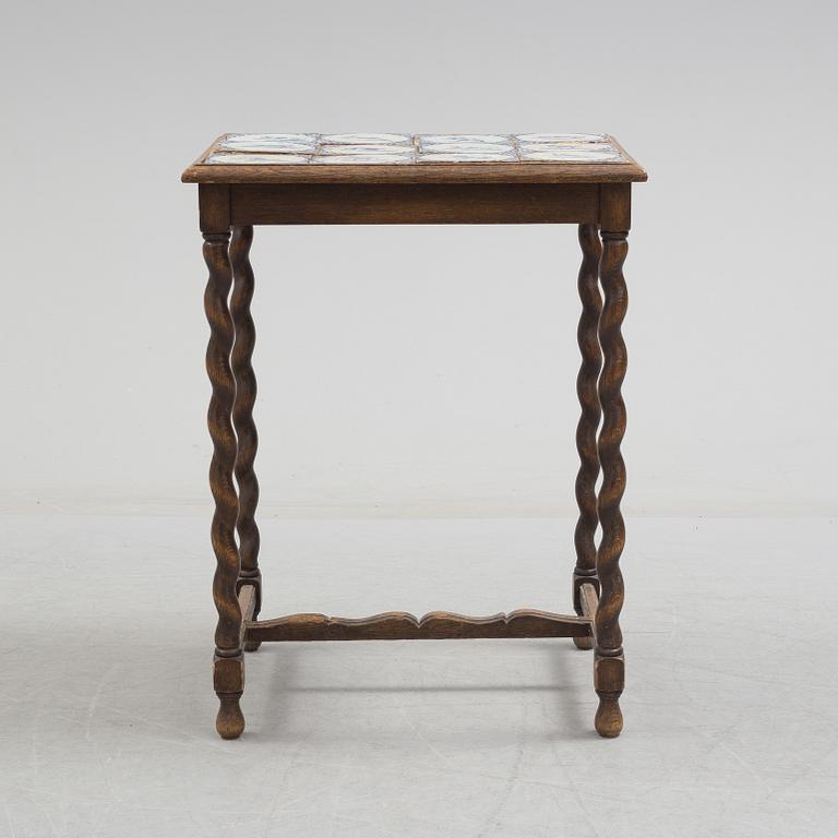 A 20th century Baroque-style table with tiles.