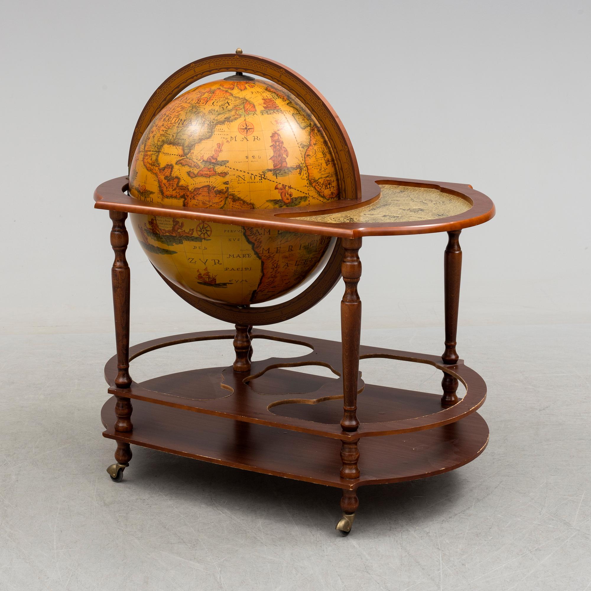 A globe shaped drinks cabinet, circa 2000.