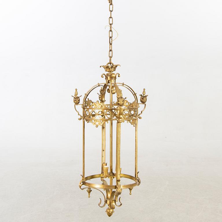 A 20th century brass ceiling lamp in Louis XV-style.