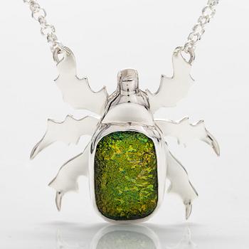 A sterling silver necklace "Gold beetle" with dichroic glass. Ru Runeberg 2019.