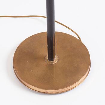 Josef Frank, a brass and black lacquered floor lamp model "2431", Firma Svenskt Tenn, Sweden.