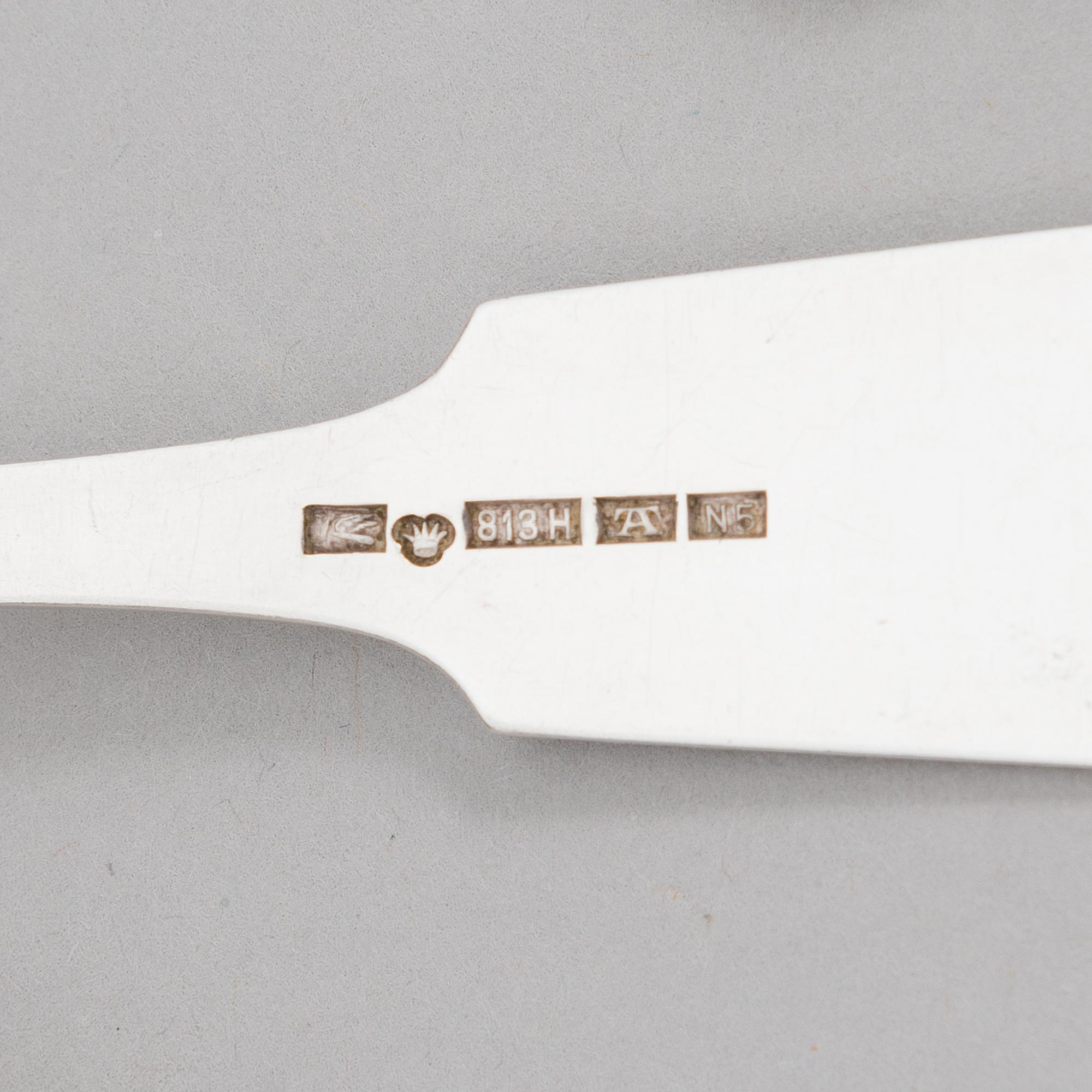 A 42-piece set of silver cutlery with seashell decorated handles, Finnish hallmarks, 1918-1950.