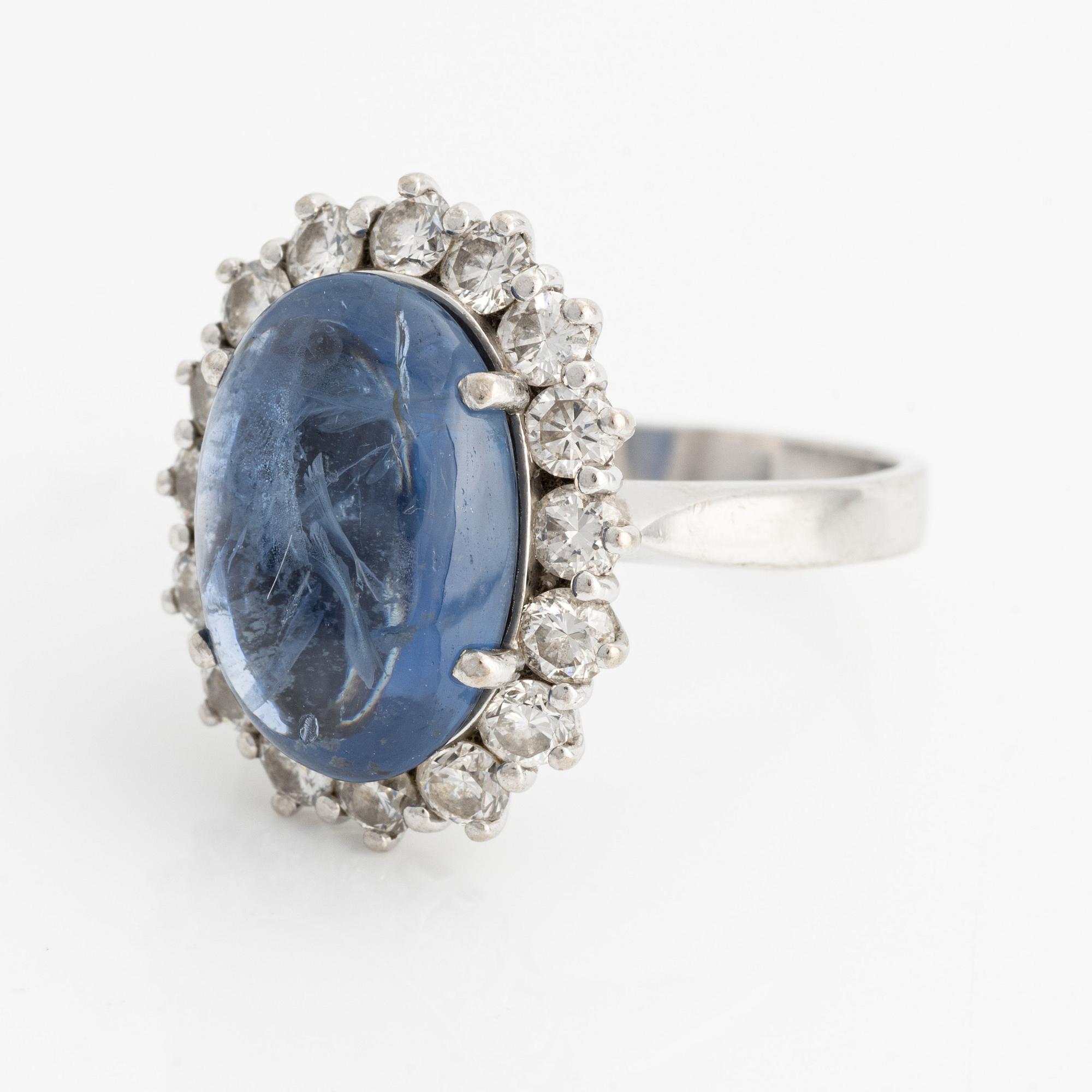Ring with cabochon-cut sapphire and brilliant-cut diamonds.