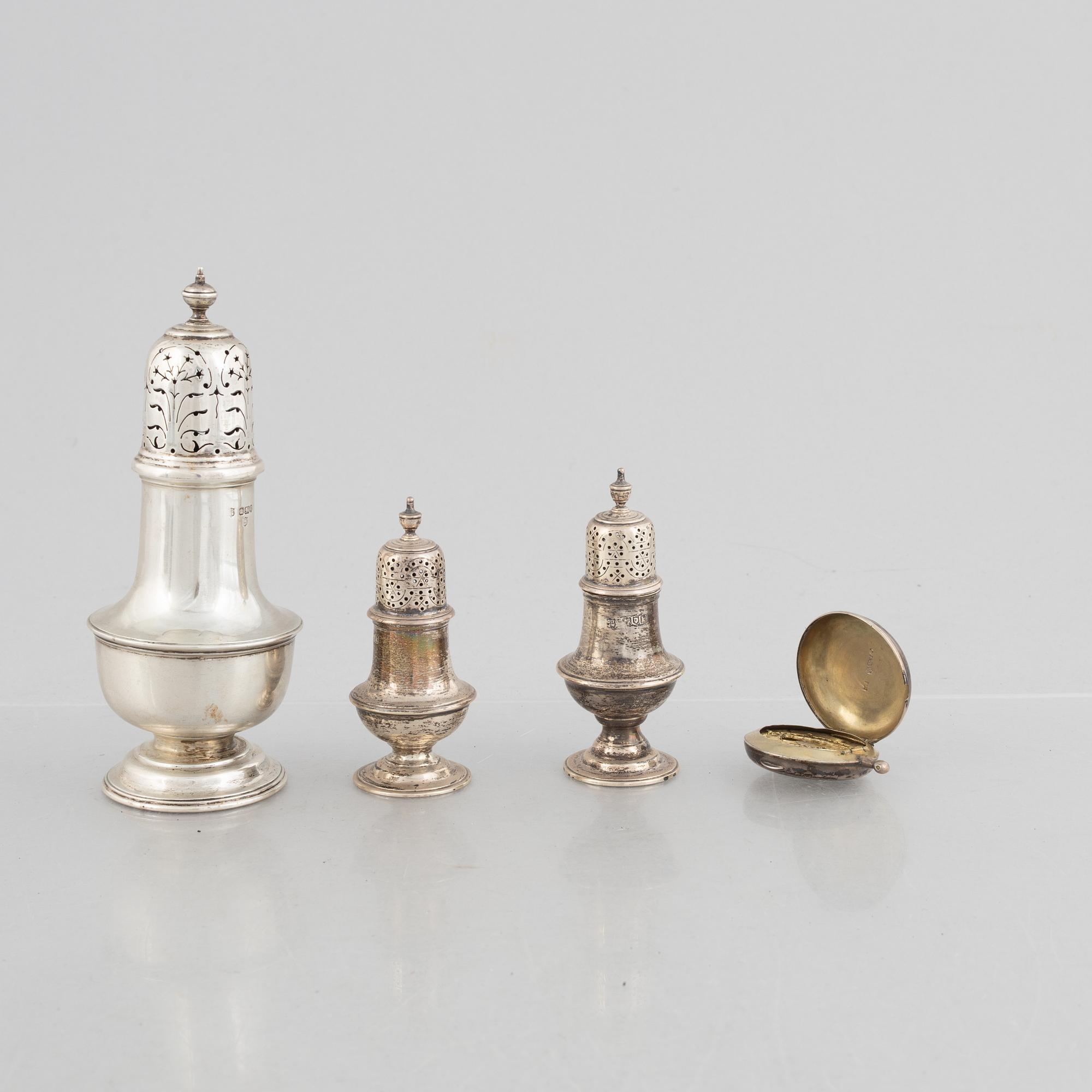 A sugar caster, a salt and pepper shaker, and a snuff-box, silver, including Daniel & John Wellby, London, England 1905.