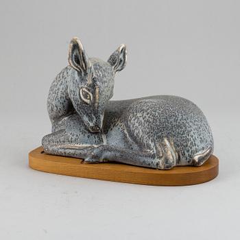 GUNNAR NYLUND, a unique stoneware sculpture of a reclining deer, Rörstrand, Sweden mid 20th Century.