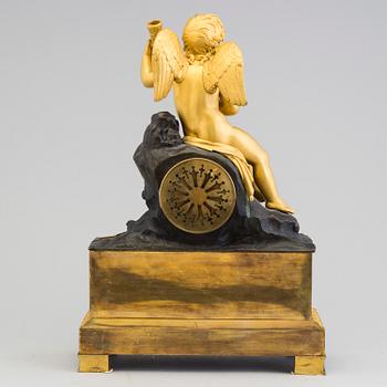 A French Empire bronze mantle clock.