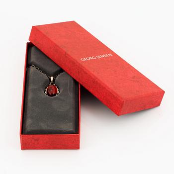 A Georg Jensen silver and cabochon-cut amber necklace.