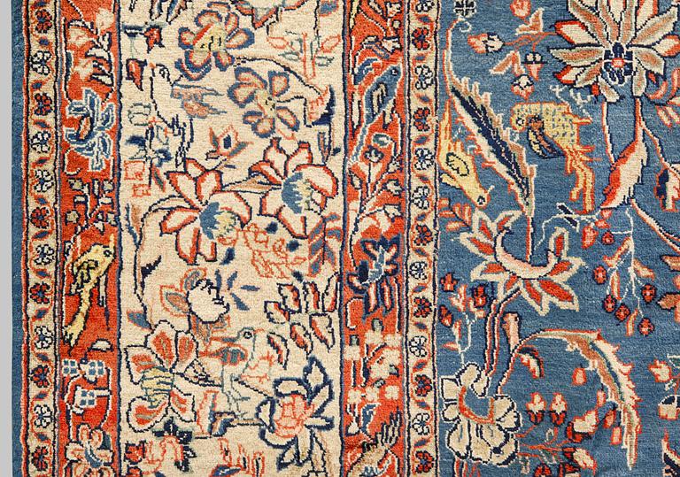 A figural Sarouk carpet, approx. 412 x 300 cm.