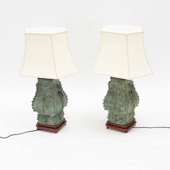 A pair of archaistic bronze vases made in to lamps, China, 20th Century.