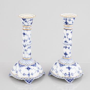 A pair of 'Blue Fluted Full Lace' porcelain Candle sticks, Royal Copenhagen, model number 1008, post 1923.