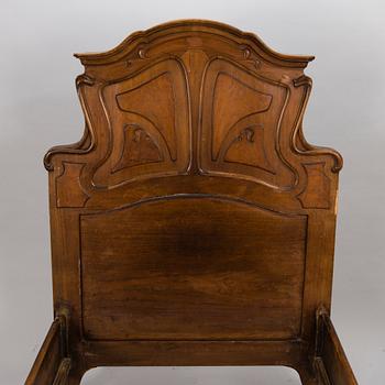 A pair of early 20th Century art nouveau style beds.