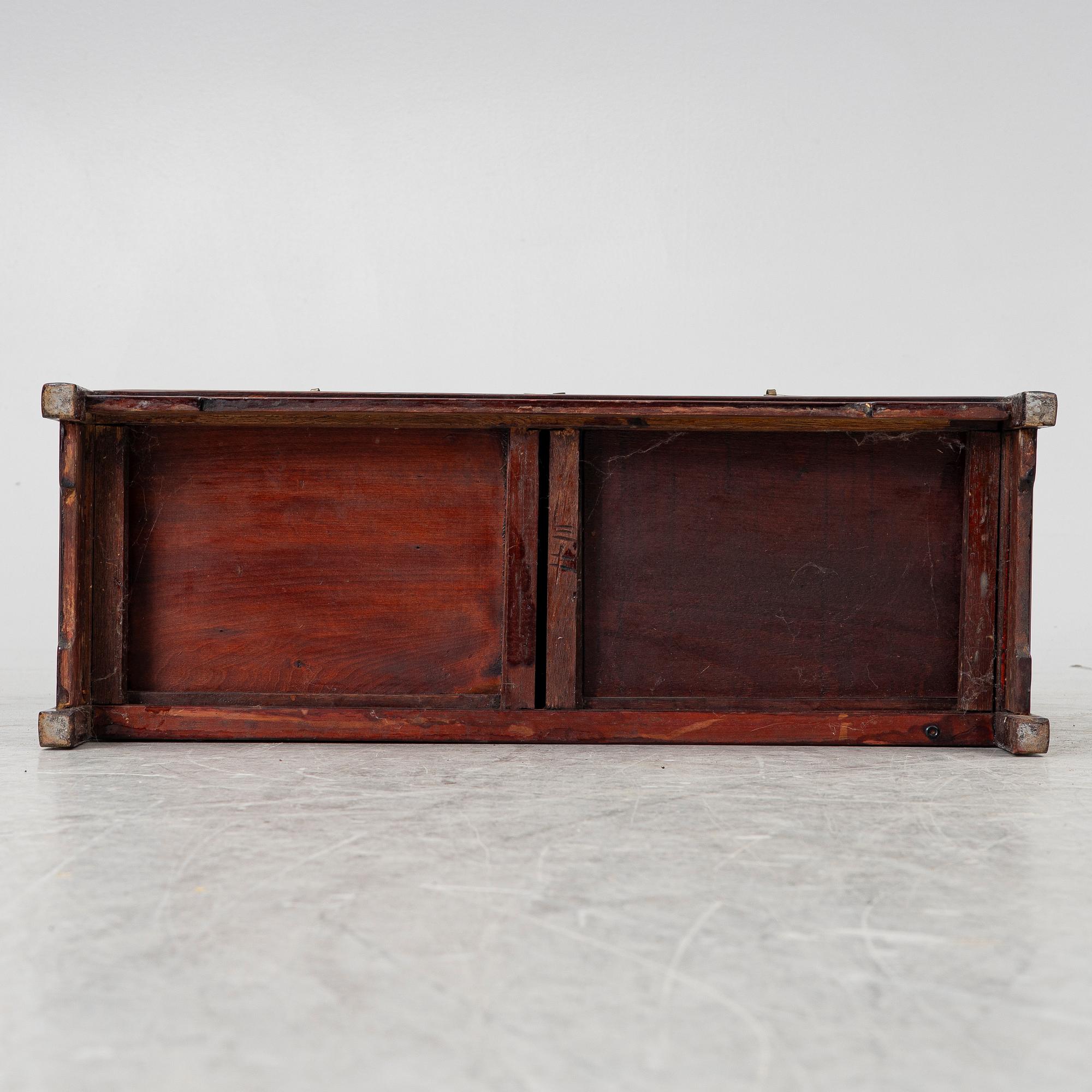 A small Chinese stained wood two part cabinet, 1900s.