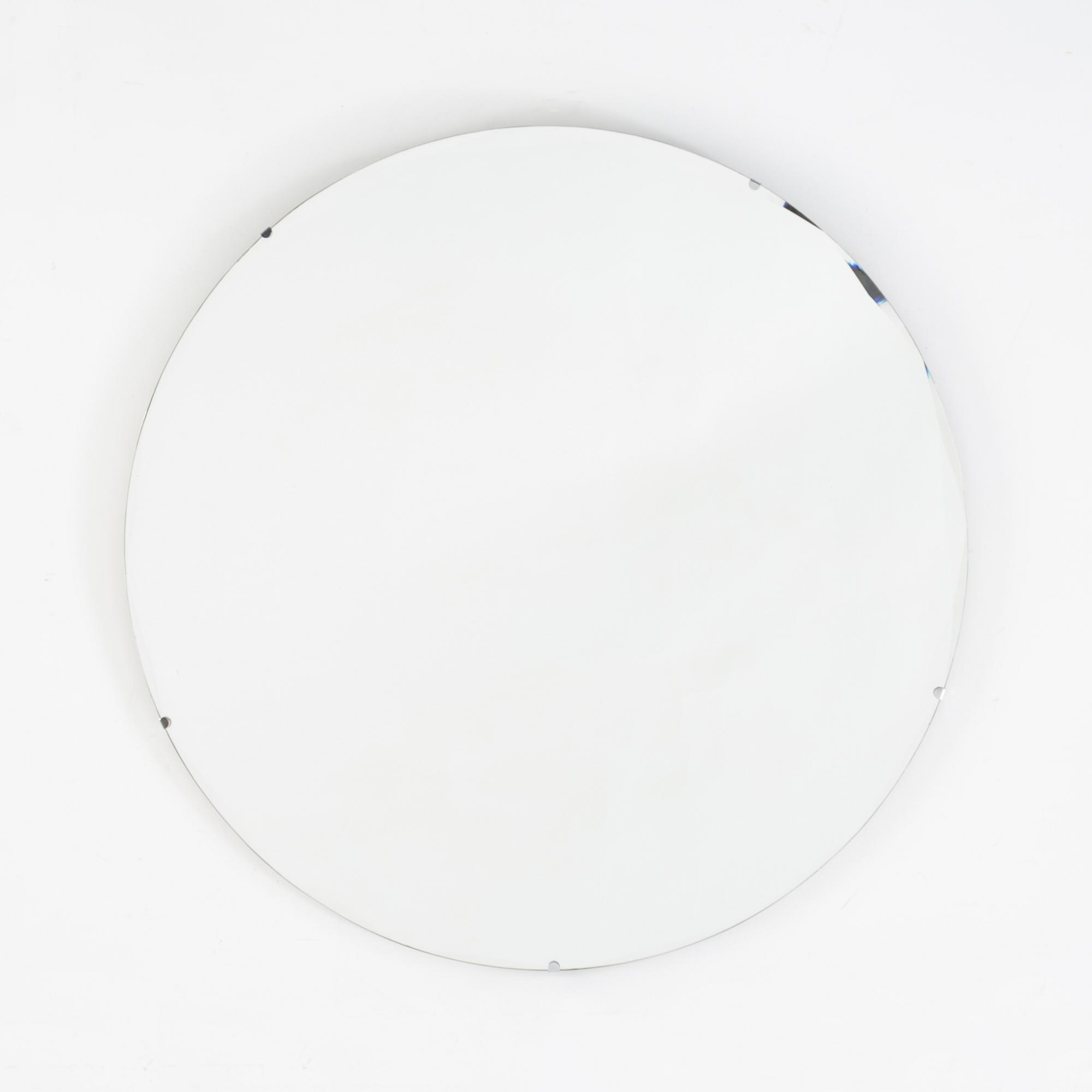 A round mirror. 1930's.