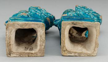 A pair of turquoise glazed censers in the shape of seated fable figures, Ming dynasty (1368-1644).