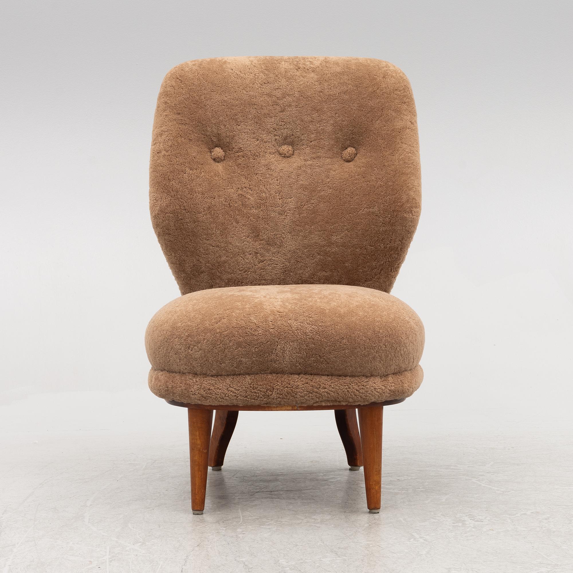 A mid 20th century easy chair,.