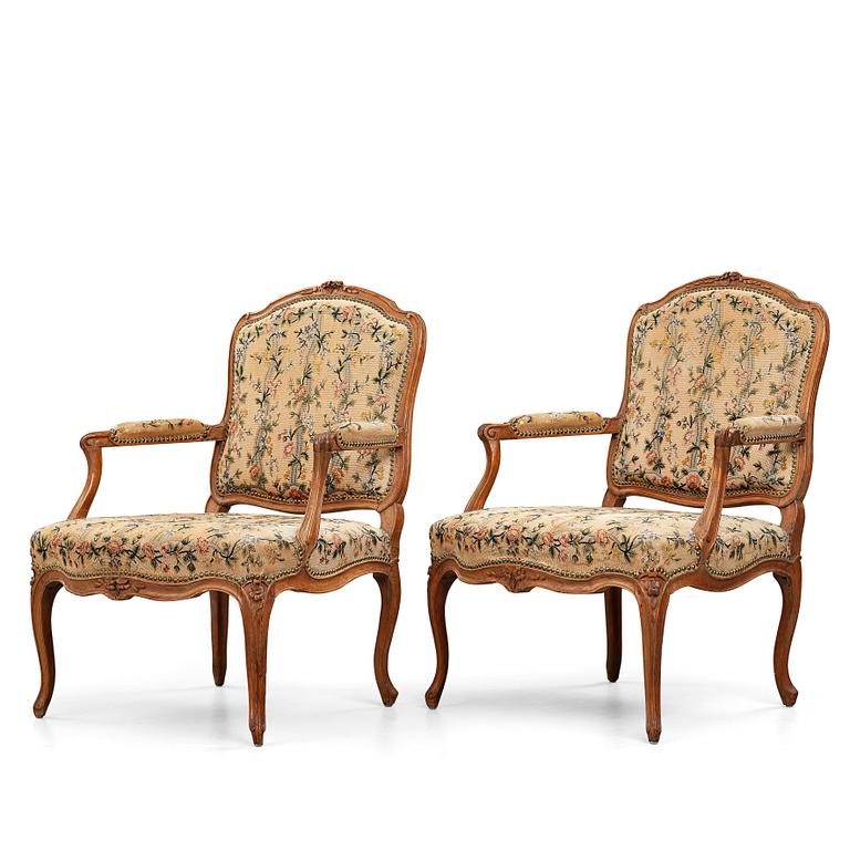 Two matched Louis XV armchairs by Charles Francois Normand (master in Paris 1747), mid 18th century.