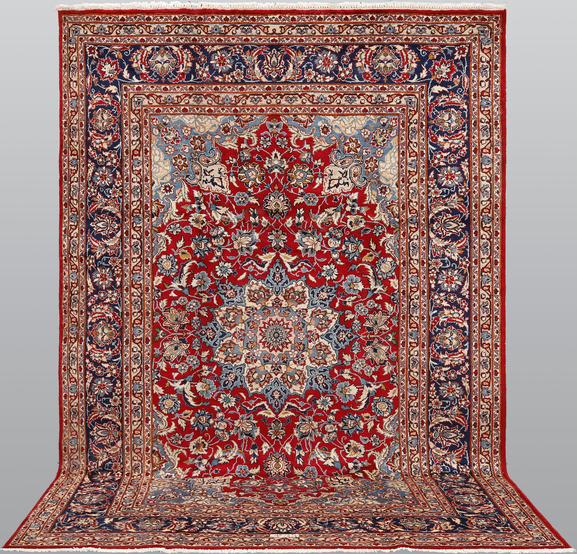 A signed Kashan carpet, ca 313 x 195 cm.