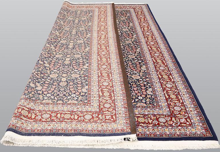 A signed Hereke carpet, ca 340 x 246 cm.