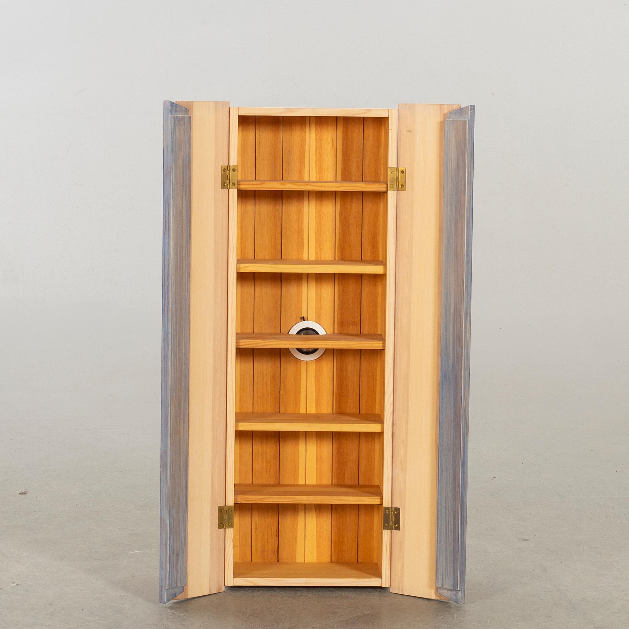 A wall cabinet "Blå ljus" design Olof Pira.