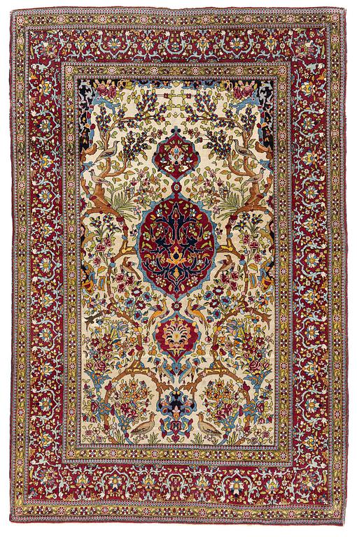 An antique Isfahan rug, Central Persia, c. 219 x 143 cm.