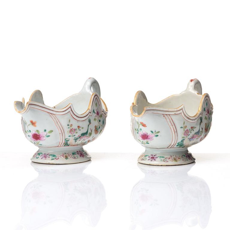 A pair of famille rose 'double peacock sauce boats, Qing dynasty, Qianlong (1736-95).