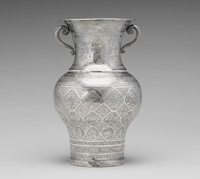 A  persian silver two handled vase from the late Qajardynasty.