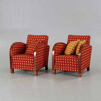 A pair of 1930s armchairs.