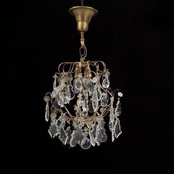 A BAROQUE STYLE CEILING LIGHT, first half of the 20th century. Height ca 45 cm.