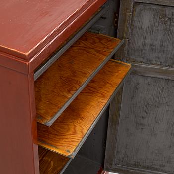 A Chinese cabinet, early 20th Century, with 19th Century carved panels.