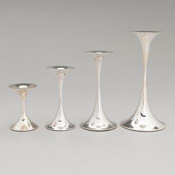 TAPIO WIRKKALA, A set of four candlesticks, "Trumpetti", marked TW,  Kultakeskus, Hämeenlinna 2001-2016.