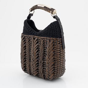 Yves Saint Laurent, a rattan and horn handbag.
