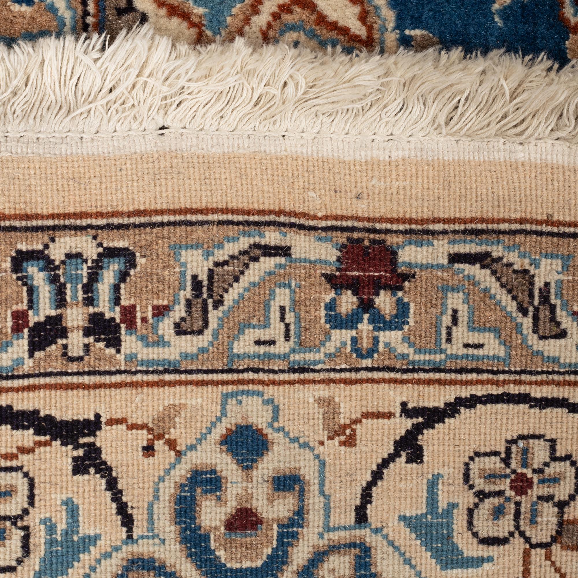 A carpet, Old Nain, part silk, ca 285 x 198 cm.