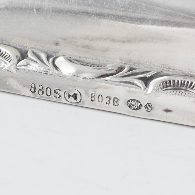 A Swedish Silver Ladle, mark of Adolf Öström, Piteå 1887 and a pair of Silver Candlesticks.