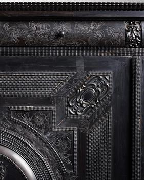 A Louis XIV and Louis XIV-style carved ebony, ivory and tortoiseshell-inlaid cabinet on stand, 17th and 19th century.