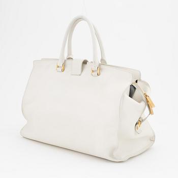 Yves Saint Laurent, a white leather handbag.