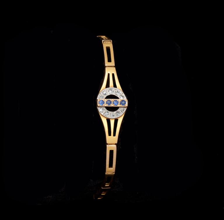 ARMBAND, 18k rödguld besatt med diamanter och safirer. Vikt 11 g.