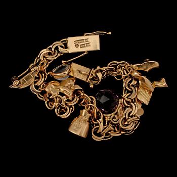 BERLOCKARMBAND, 18k guld med månsten och ametist, Gustav Dahlgren & Co, Malmö, 1963. Vikt 22 g.