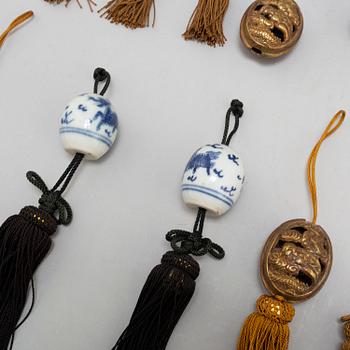 Eight (6+2) tassles, porcelain and bronze, Japan, 20th century.