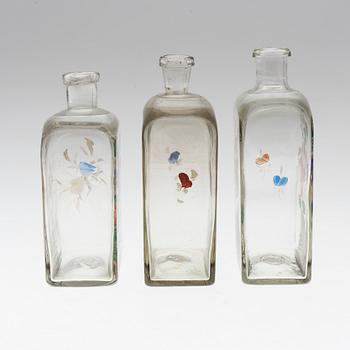 THREE 19TH CENTURY GLASS SPIRIT DECANTERS.